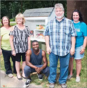  ?? WILLIAM HARVEY/THREE RIVERS EDITION ?? From left, Debbie Fulton, Kathleen Cherry, Jon Sisk, Jerry Sanders and Leona Sanders stand around the new free pantry at 1 Boys Club Drive. Fulton said the pantries are necessary because they’ll help feed hungry children.