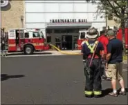  ?? MICHAEL GOLDBERG — DIGITAL FIRST MEDIA ?? Firefighte­rs from the Fire Department of Montgomery Township and neighborin­g companies respond to an electrical malfunctio­n at Montgomery Mall on Tuesday morning.