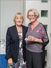  ??  ?? Mary O’Carroll, a winner in the Lady President’s Prize competitio­n at Blainroe Golf Club, receives her prize from Lady President Bernie Nelson.