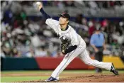  ?? WILFREDO LEE / AP ?? Japanese pitcher Yoshinobu Yamamoto, here delivering during the World Baseball Classic, will be allowed to move to an MLB team under the player posting system. He is expected to have plenty of suitors.