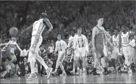  ?? AP/DAVID J. PHILLIP ?? North Carolina's Theo Pinson (1) celebrates as Oregon's Payton Pritchard (3) walks off the court Saturday in Glendale, Ariz.