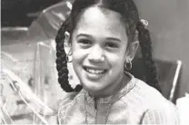  ?? KAMALA HARRIS CAMPAIGN VIA AP ?? This photo shows Kamala Harris as a child at her mother’s lab in Berkeley. Harris’ mother was a biomedical scientist.