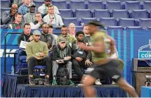  ?? Darron Cummings/Associated Press ?? Arizona State defensive lineman Nesta Silvera runs a drill at the NFL scouting combine in Indianapol­is on Thursday. The event is a moneymakin­g machine for the league, but opinions vary on how useful it really is.