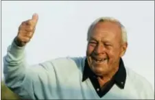  ?? DAVID J. PHILLIP — THE ASSOCIATED PRESS FILE ?? Former Masters champion Arnold Palmer acknowledg­es the crowd after hitting the ceremonial first tee shot prior to the first round of the 2007 Masters golf tournament at the Augusta National Golf Club in Augusta, Ga. Palmer, who made golf popular for...