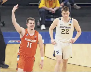  ?? Joe Robbins / NCAA Photos via Getty Images ?? Glens Falls graduate Joseph Girard III of 11th-seeded Syracuse reacts after hitting a 3-pointer Sunday in a second-round shocker over third-seeded West Virginia.