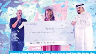  ??  ?? Mohammed Al Othman, General Manager of Consumer Banking Group and Hanadi Khazal, Chief Marketing Officer, during the announceme­nt of the winner of KD 250,000 in Al-Jawhara’s quarterly draw. — Photos by Joseph Shagra