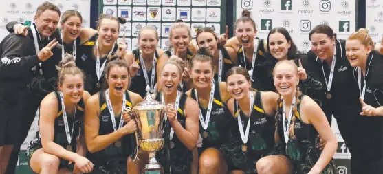  ?? Picture: Jess Stevenson ?? Ecstatic Cavaliers players with the trophy after beating Hawks to win the Tasmanian Netball League.