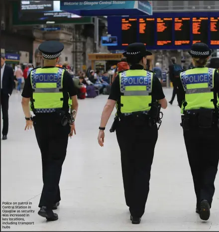  ??  ?? Police on patrol in Central Station in Glasgow as security was increased in key locations, including transport hubs