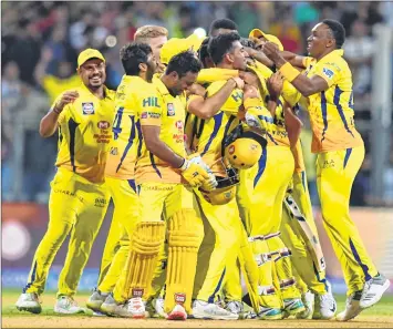  ??  ?? Champions Chennai Super Kings’ players celebrate after completing eight-wicket win over Sunrisers Hyderabad in Mumbai on Sunday