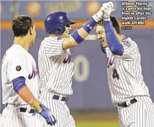  ?? GETTY ?? Wilmer Flores (r.) gets his high fives in after his eighth career walk-off RBI.