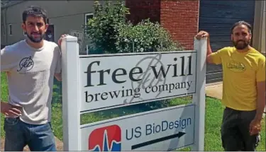  ?? News-Herald photos — DEBBY HIGH ?? Free Will Brewing Co. founders Dominic Capece, left, and John Stemler stand outside the company’s location at 410 E. Walnut St. in Perkasie.