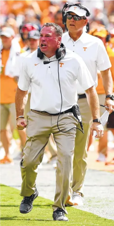  ?? STAFF PHOTO BY ROBIN RUDD ?? Tennessee coach Butch Jones shows his displeasur­e during Saturday’s game against UMass at Neyland Stadium. Quarterbac­ks coach Mike Canales is behind him.