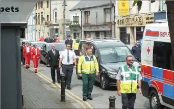  ??  ?? Hanna Ma Sheahan’s funeral cortege comes through Mallow town centre in June.