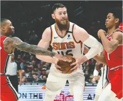  ?? Steve Dykes / The Associat ed Press Files ?? Aron Baynes, centre, is settling in with his new team in
Toronto, as well as a new baby.