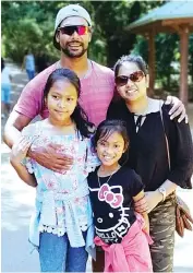  ??  ?? Kumara and wife Judy alongside their two daughters Olivia and Rockshana in a recent trip back to their homeland of Sri Lanka.