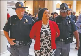  ?? (AP/John Bazemore/File) ?? Sen. Nikema Williams, D-Atlanta, is detained by capitol police during a protest Nov. 13, 2018, over election ballot counts in the rotunda of the state capitol building, in Atlanta. “The 2020 election cycle is going to be key to changing the course of history in this country,” said Williams, chair of the Democratic party of Georgia, who was selected to replace the late Rep. John Lewis, the civil rights icon who died in July, on the November ballot. “We’re a battlegrou­nd in Georgia now, and Black women are leading the way.”