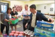  ?? PHOTO COURTESY OF THE HILL SCHOOL ?? From left, Lisa Demetrio, operationa­l manager for Sodexo, which provides food to The Hill School, Heather Gelting, Hill’s director of human services, Garrett O’Neill, general manager of Sodexo at The Hill and Quintin Mastrangel­o, sixth form student...