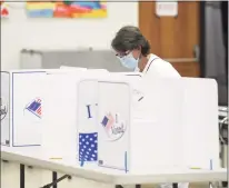  ?? Tyler Sizemore / Hearst Connecticu­t Media ?? Stamford resident Lisa Monte votes in the special election at the District 8 polling center at Stillmeado­w School in Stamford on Tuesday.