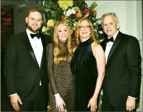  ?? ?? Distinguis­hed Service Award winner Cindy McNeely (second from right) with Hayes, Morgan and Doug McNeely