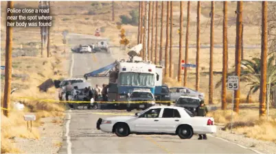  ??  ?? Police close a road near the spot where her body was found