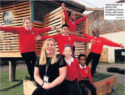  ?? JON KENT ?? Head teacher at Barton Hill Academy, Emma Tovey, with some of school’s pupils