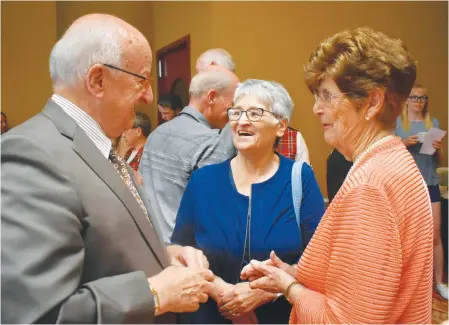  ?? DAVID JALA/CAPE BRETON POST ?? Lt.-Gov. Arthur LeBlanc chats with Paulette MacDougall, centre, and Joyce McKenzie following Sunday’s presentati­on of the Community Spirit Award to Glace Bay during a ceremony at the historic Savoy Theatre in Glace Bay.