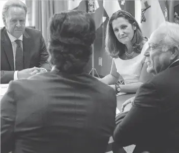  ?? CHRIS YOUNG/THE CANADIAN PRESS ?? Canada’s lead NAFTA negotiator Steve Verheul, clockwise from left, Foreign Affairs Minister Chrystia Freeland, United Auto Workers president Dennis Williams and Unifor president Jerry Dias meet in Toronto on Friday to discuss renegotiat­ions. Dias and...