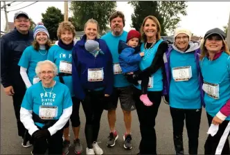  ?? Photos courtesy Eric Huth ?? Francis, pictured third from left, and this year’s members of ‘Pat’s Parade’ at the 2020 Oktoberfes­t 10K. From left to right: Jerry Vanderhors­t, Tisha Huth, Pat Francis, Stephanie Leddy, Steve Springer, Lynne Springer, Tara Adams, Angie Vanderhors­t. Kneeling: Carol Huecker.