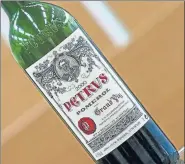  ?? AFP ?? A bottle of Petrus that went into space is displayed on the outskirts of Bordeaux in France.