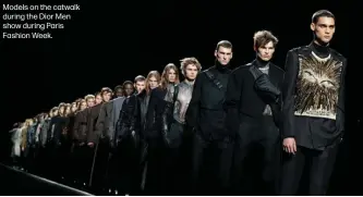  ??  ?? Models on the catwalk during the Dior Men show during Paris Fashion Week.