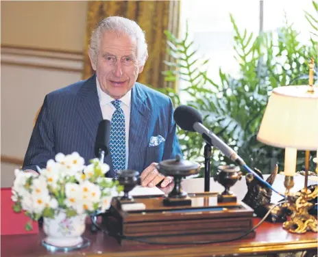  ?? ?? EASTER MESSAGE: Charles at his desk in Buckingham Palace’s 18th Century Room as he recorded his message.