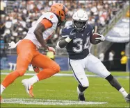  ?? Jessica Hill / Associated Press ?? UConn’s Kevin Mensah (34) is pursued by Illinois’ Tony Adams on Sept. 7. The Big Ten’s decision to play only conference games this season means the teams won’t meet again in 2020.