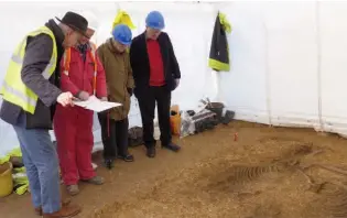  ??  ?? Left: From left, John Dent, excavator of Garton/Wetwang Slack cemetery, Mark Stephens,
map site director, Sheelagh Stead and Ian Stead, excavator of Burton Fleming/ Rudston and other cemeteries, at the Burnby Lane chariot burial
Right: The skeleton of a man crouches behind a pair of ponies in the chariot box at The Mile (scale 1m); see opposite page