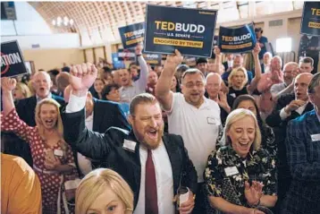  ?? MELISSA SUE GERRITS/GETTY ?? Supporters of Rep. Ted Budd, R-NC, celebrate his Senate GOP nomination at a party Tuesday.