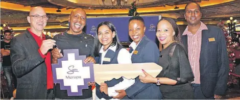  ?? PHOTO: SUPPLIED ?? Winner Johannes Lethole (second
from left) is congratula­ted by Meropa General Manager, Peter Guthrie, PR & Promotions Manager, Raksha Gunpath, Events Coordinato­r, Ramokone
Mokwatlo, Mercedes-Benz sales executive, Mokgadi Senyatsi and Gaming Manager, Rave
Moodley.