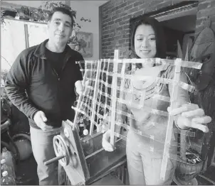  ?? Bob Donaldson/Post-Gazette ?? David Saiia and Vananh Le started the Reuse Everything Institute with the goal of turning plastic bottles into a variety of useful items, including roof thatch and constructi­on fencing.