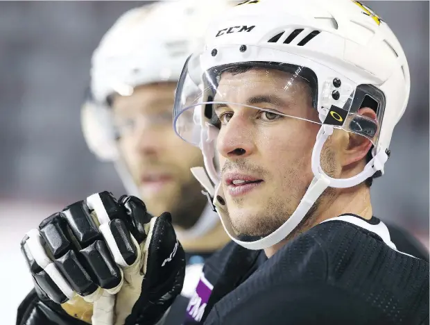  ?? — POSTMEDIA ?? Pittsburgh captain Sidney Crosby is back on the ice practising but not yet playing in games after suffering an “upper-body injury.”