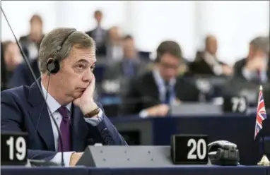  ?? AP PHOTO/JEAN-FRANCOIS BADIAS, FILE ?? In this file photo dated Wednesday, Jan.17, 2018, former U.K. Independen­ce Party leader and MEP Nigel Farage listens to speeches at the European Parliament in Strasbourg, eastern France. According to an article written by Farage and published Saturday Aug. 18, 2018, Farage says he is joining up with a pro-Brexit pressure group to oppose Britain’s Prime Minister Theresa May’s plan for future ties with the European Union.