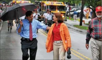  ?? DIGITAL FIRST MEDIA FILE PHOTO ?? State Rep. Greg Vitali and Sarah Armstrong, his 2016 Republican opponent, march in during the Garrett Hill Fourth of July parade. the