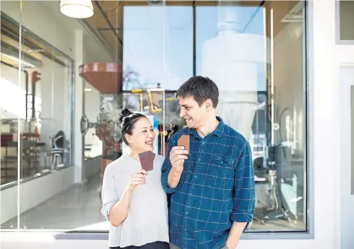  ?? COLE BURSTON FOR THE TORONTO STAR ?? Cynthia Leung and David Castellan pose in the under-constructi­on location of their new Soma Chocolate factory near Toronto's Brockton neighbourh­ood.