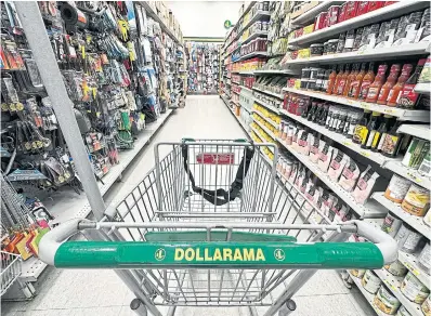  ?? CHRISTINNE MUSCHI THE CANADIAN PRESS FILE PHOTO ?? Dollarama posted a profit of $323 million while also increasing its dividend nearly 30 per cent to 92 cents a share.