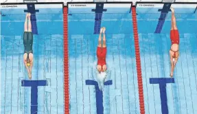  ?? ANTONIO BRONIC/REUTERS ?? Swimmers from Australia, Canada and China dive into the pool during the women’s 4x100 freestyle relay at the Tokyo Olympics.