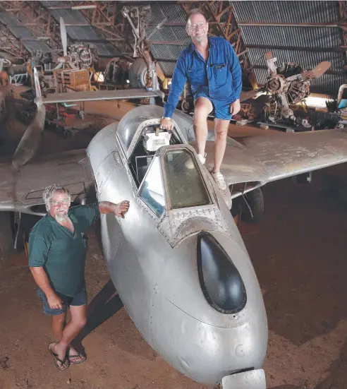  ?? Picture: ANNA ROGERS ?? COLLECTOR’S EDITION: Brothers Peter and Norman Beck with the De Havilland sale at the Beck Military Museum at Mareeba. Vampire fighter jet, which is one of the many items for