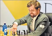  ?? ?? Magnus Carlsen in action against Ian Nepomniach­tchi.