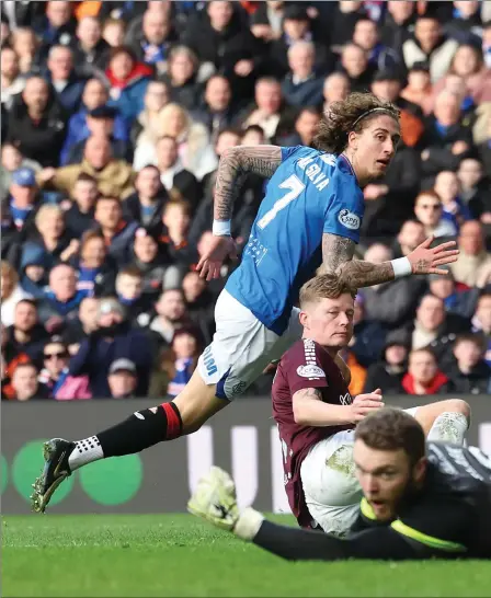  ?? ?? Striker Fabio Silva scores past goalkeeper Zander Clark to make it 5-0 to the home side at Ibrox as Rangers made light work of Hearts