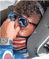  ??  ?? Driver Bubba Wallace sits in his car prior to the start of the NASCAR Cup Series race at Talladega Superspeed­way on Monday.