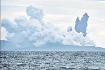  ??  ?? Mount Anak Krakatau volcano spews hot ash during an eruption as seen from Indonesian Naval Patrol Boat, KRI Torani 860, at Sunda strait in Banten. — Reuters photos