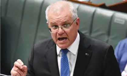  ?? Photograph: Lukas Coch/AAP ?? Prime minister Scott Morrison. A Senate inquiry has heard the Coalition government’s commuter car parks scheme would ‘amount to corruption’ under a NSW-style integrity watchdog.