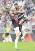  ?? REUTERS ?? AC Milan’s Olivier Giroud, left, vies with Juventus’ Bremer.