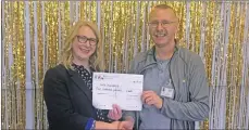  ??  ?? Alison McGrory hands out a certificat­e to Raymond Deans for NHS Chaplaincy.
